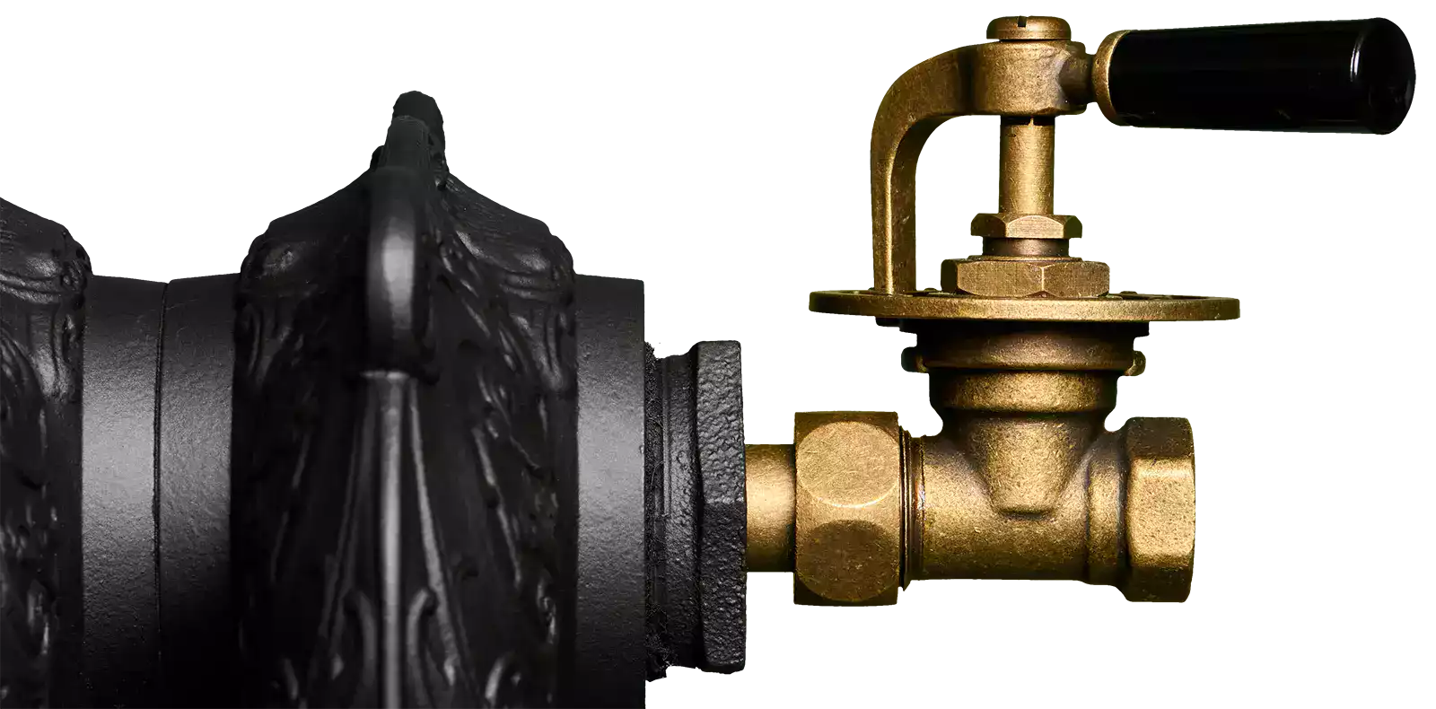 Robinet à manette en laiton monté sur un radiateur en fonte ancien